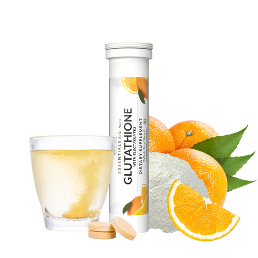 Image of a toub of Essentials Glutathione with electrolyte tablets. Around the toub are glutathione powder, oranges, glutathione tables, and a glass with a dissolving tablet inside.