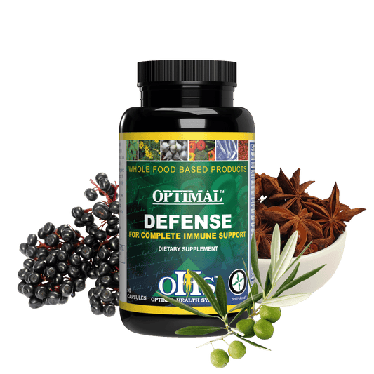 Image of a bottle of Optimal Defence. Around the bottle is a picture of a bunch of elderberries, an olive branch with green olives, and a bowl of anise seed.
