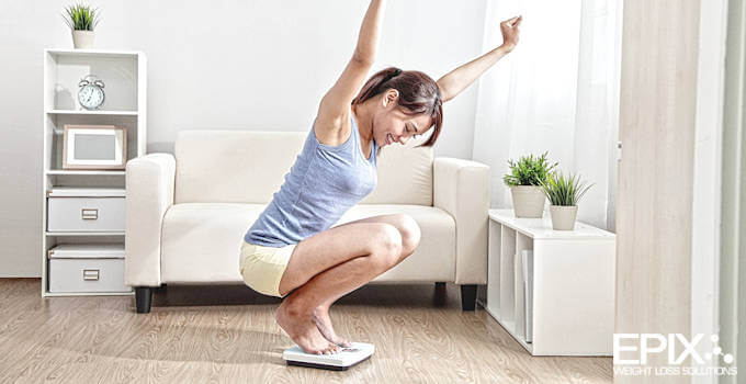 Woman-Excited-To-Get-Through-Weight-Loss-Plateau