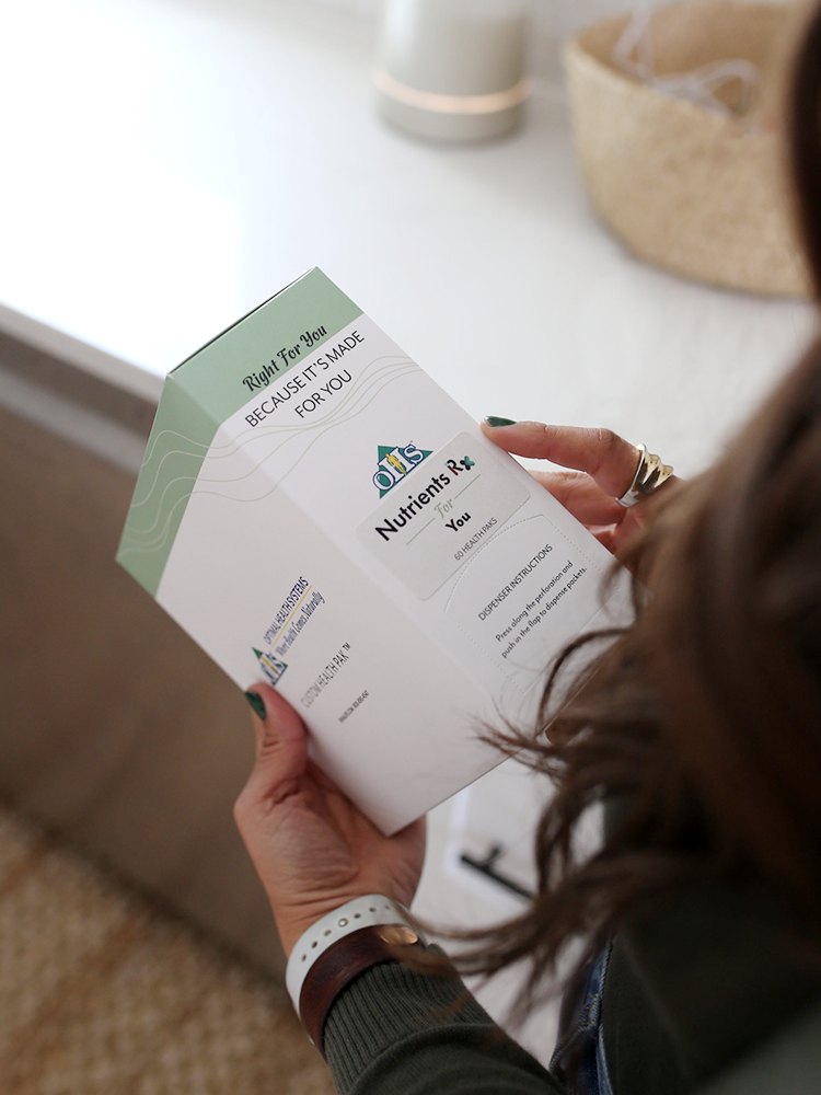 Woman looking at a nutrient RX pak.