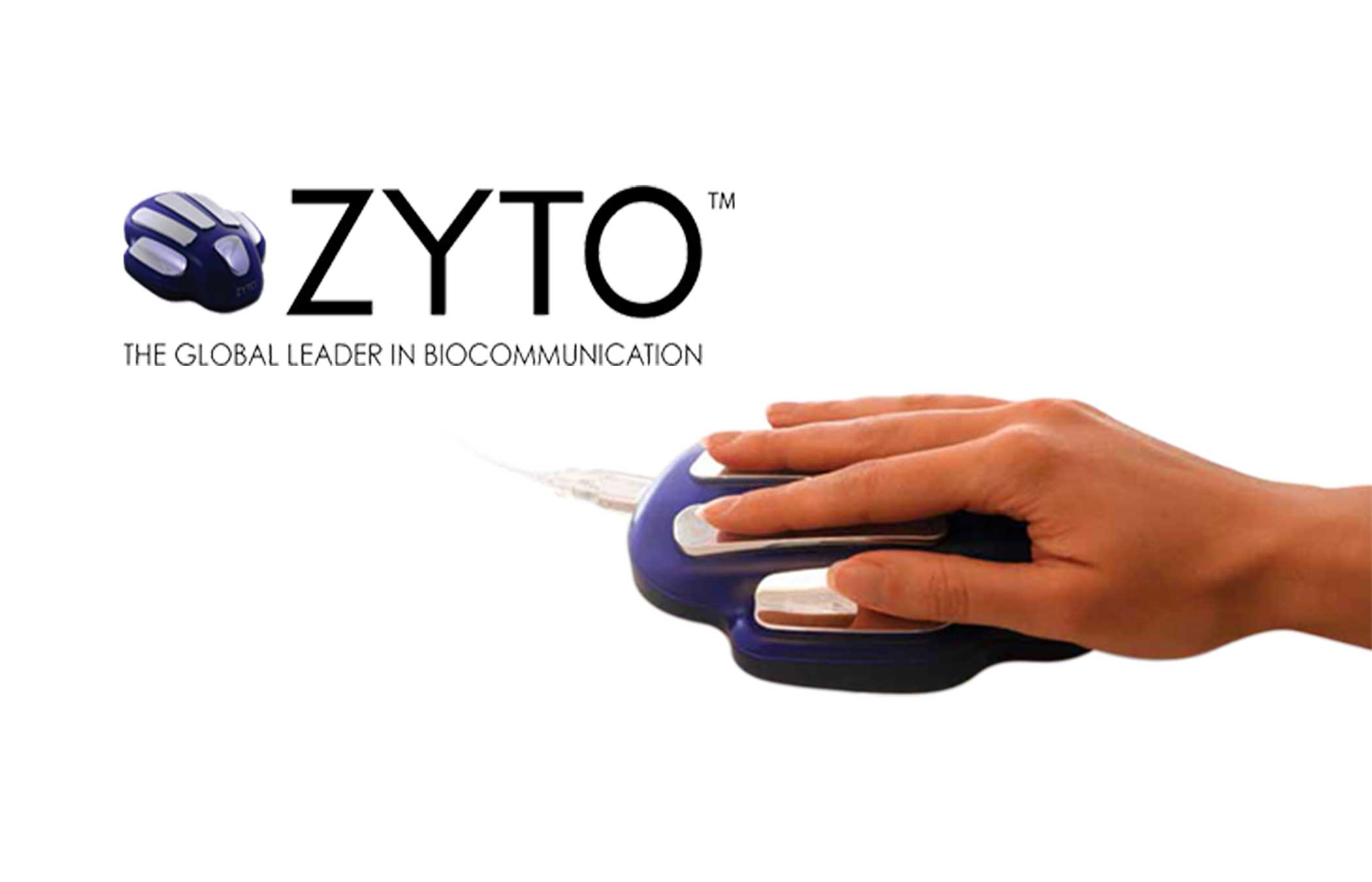 The image has a picture of a ZYTO hand cradle, then the text "ZYTO tm THE GLOBAL LEADER IN BIOCOMMUNICATION," and the larger ZYTO hand cradle with a hand placed on it.